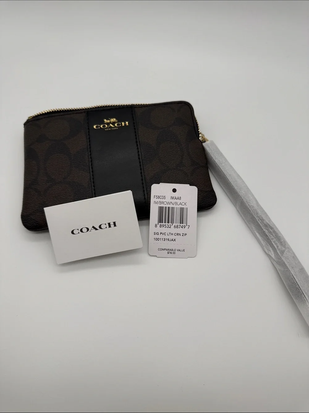 Coach Brown and Black Signature Zip Card Holder 45.00